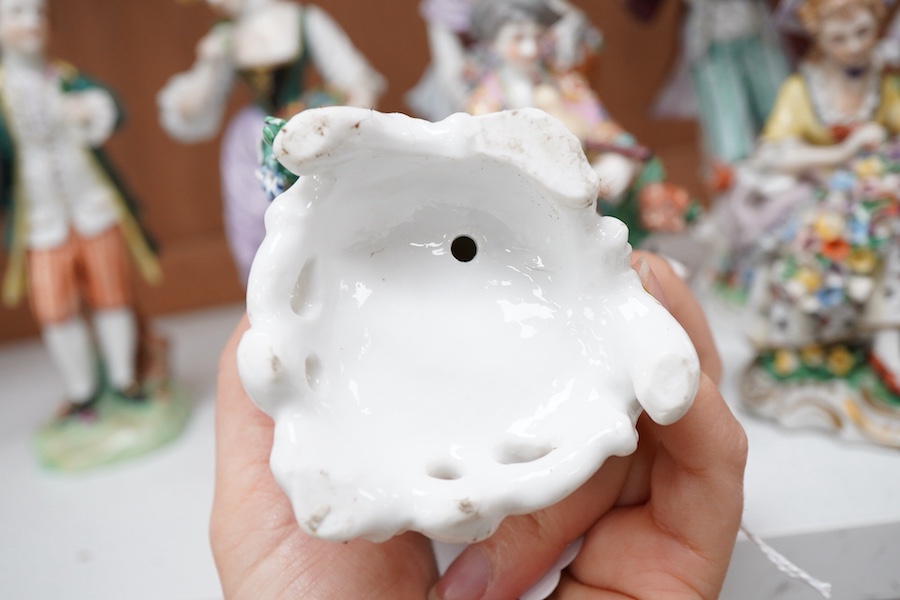 Four pairs of porcelain figures, a single figure and seated figure group, all after Chelsea and Derby originals, together with a Meissen style schneeballen porcelain sucrier and cover, (12)